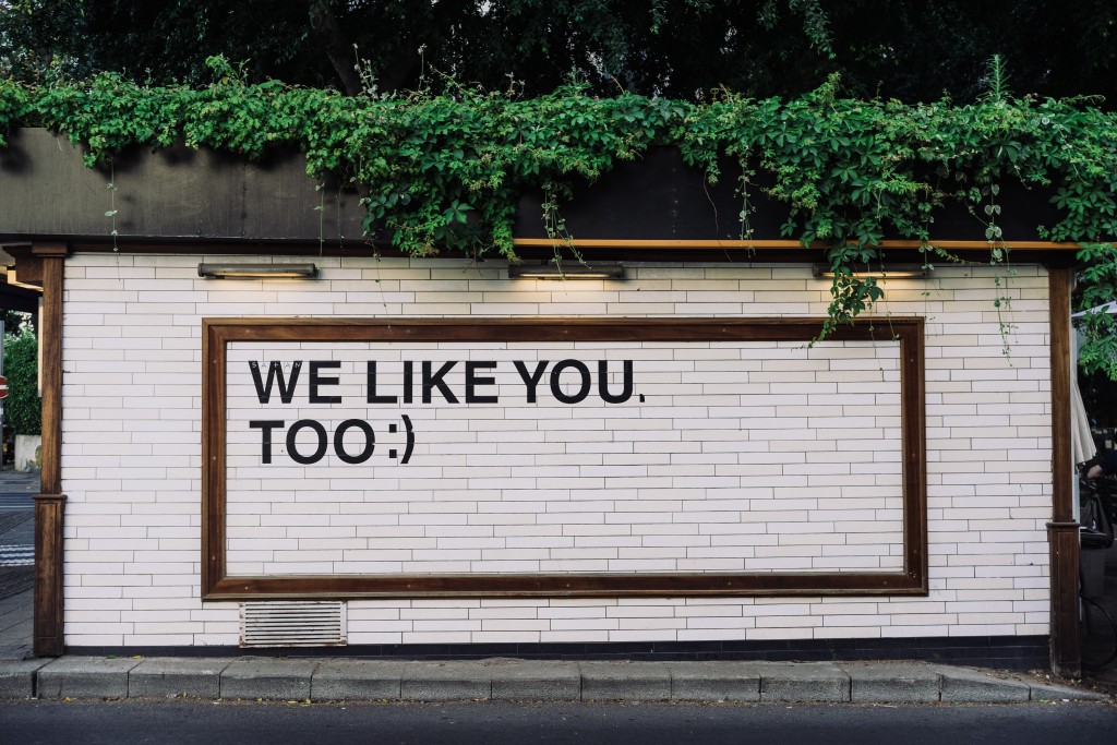 a digital community style text written on a wall
