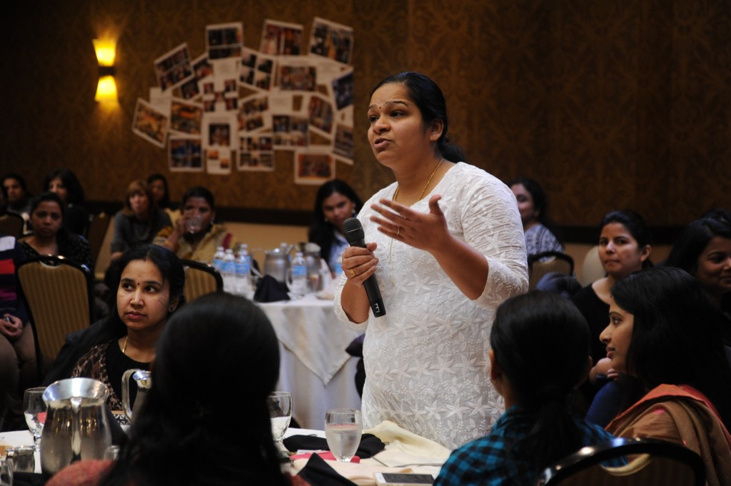 a woman speaking at a digital community conference in asia